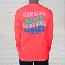 Load image into Gallery viewer, Back of tee: If you&#39;re looking to stand out, the neon-orange, long-sleeve t-shirt with words to live by at the Gulf Coast is a great choice. Festive for runners, first responders or beachcomers, the hip lettering is reminiscent of the iconic 60&#39;s. Our Beach Oysters Sunset Neon Orange tee lets you dress like you&#39;re at the beach year round. 

