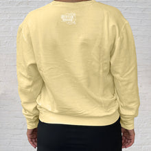 Load image into Gallery viewer, The back of the Gulf Shores Butter sweatshirt is branded with the Original Oyster House logo.

