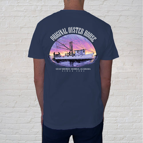 Back of Tee: The Sunset Oyster Boat Blue t-shirt is a breathtaking illustration of a Gulf Coast sunset. The state of Alabama is the largest processor of oysters in the US and the design captures the beauty of a spectacular sunset after a hard day of work for the oystermen.