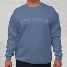 Load image into Gallery viewer, The blue denim Comfort Color crewneck sweatshirt is made of 100% ring-spun cotton. Gulf Shores is imprinted in magenta on the front. This popular beach destination has a warm, humid climate tempered by sea breezes during the summer months and near-perfect 70 degrees in November. Front Gulf Shores View.
