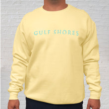 Load image into Gallery viewer, The butter yellow Comfort Color crewneck sweatshirt is made of 100% ring-spun cotton. Gulf Shores is imprinted in magenta on the front. This popular beach destination has a warm, humid climate tempered by sea breezes during the summer months and near-perfect 70 degrees in November. Front Gulf Shores View.
