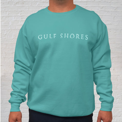 The seafoam green Comfort Color crewneck sweatshirt is made of 100% ring-spun cotton. Gulf Shores is imprinted in magenta on the front. This popular beach destination has a warm, humid climate tempered by sea breezes during the summer months and near-perfect 70 degrees in November. Front Gulf Shores View.