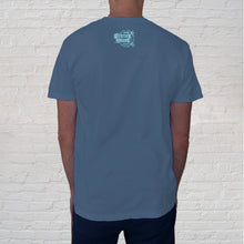 Load image into Gallery viewer, A year-round attraction, Gulf Shores features sugar-white sand beaches, turquoise waters, and stunning sunsets. The Gulf Shores front imprint on a short-sleeve Blue Denim Comfort Color short sleeve t-shirt is one of our best selling tees. Back Branded logo View.

