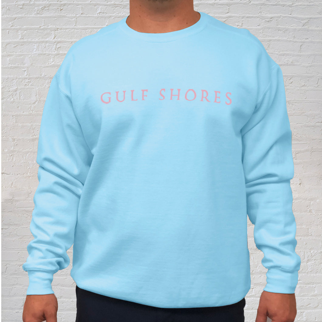 The light blue Comfort Color crewneck sweatshirt is made of 100% ring-spun cotton. Gulf Shores is imprinted in magenta on the front. This popular beach destination has a warm, humid climate tempered by sea breezes during the summer months and near-perfect 70 degrees in November. Front View.