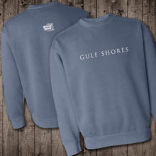 Load image into Gallery viewer, The blue denim Comfort Color crewneck sweatshirt is made of 100% ring-spun cotton. Gulf Shores is imprinted in magenta on the front. This popular beach destination has a warm, humid climate tempered by sea breezes during the summer months and near-perfect 70 degrees in November. Front &amp; Back view.
