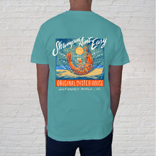 Load image into Gallery viewer, Back of t-shirt design | With Gulf Shores being home of the National Shrimp Festival and avid shrimpers all around, we had to feature a great &quot;Shrimpin Ain&#39;t Easy&quot; tee. Although from the vantage of this shrimp, life is easy. Relaxing in a waterfront hammock, cooled by sea breezes with a cocktail in hand, this shrimp is loving the good life of the Gulf Coast. 
